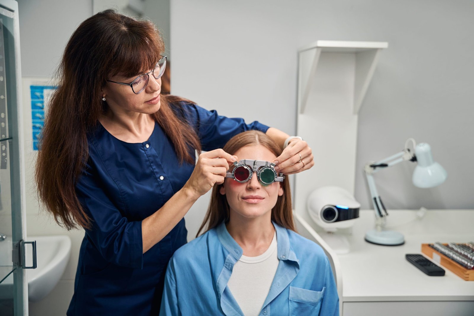 doctor-optometrist-fitting-trial-frame-on-patient-2025-03-08-20-27-28-utc-min