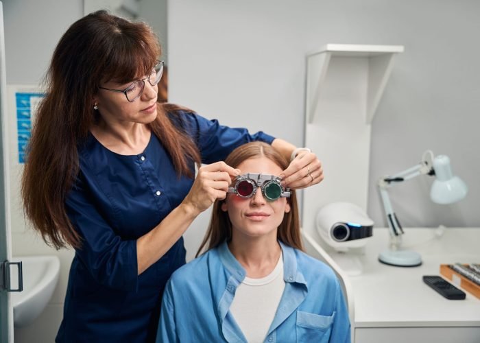 doctor-optometrist-fitting-trial-frame-on-patient-2025-03-08-20-27-28-utc-min