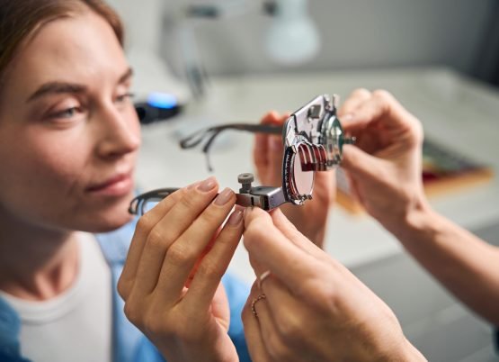 female-patient-examining-lenses-in-trial-frame-2025-03-09-11-19-08-utc-min