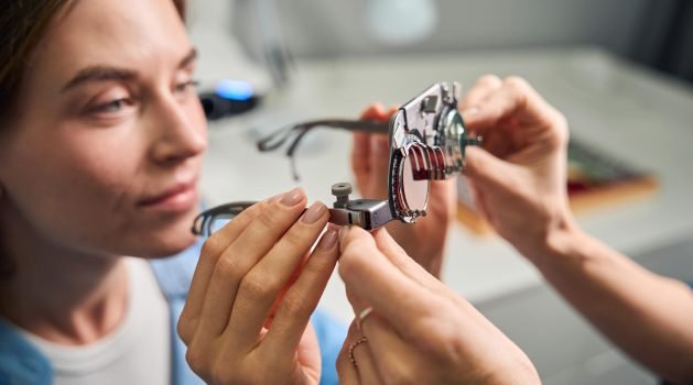 female-patient-examining-lenses-in-trial-frame-2025-03-09-11-19-08-utc-min